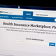 A woman looks at the HealthCare.gov insurance exchange internet site Oct. 1. (KAREN BLEIER/AFP/Getty Images)